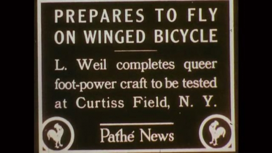 1890s: News for test of flying contraption. Man pedals contraption to make wings flap in and out. Man steers contraption. News poster for invention. Man pedaling a two-wheeled, winged contraption. 