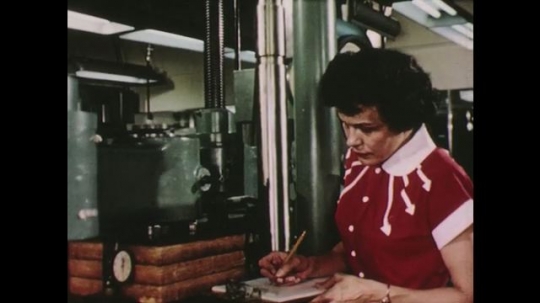 UNITED STATES: 1950s: lady works in research department. Workers in research department. Product development. Industrial research.