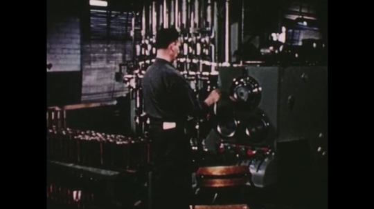 UNITED STATES: 1950s: mechanical production of glass. Graduated cylinders. 