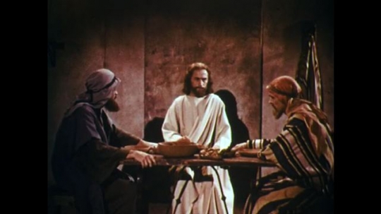 UNITED STATES: 1950s: Jesus eats at table with men. Jesus breaks bread. Jesus disappears