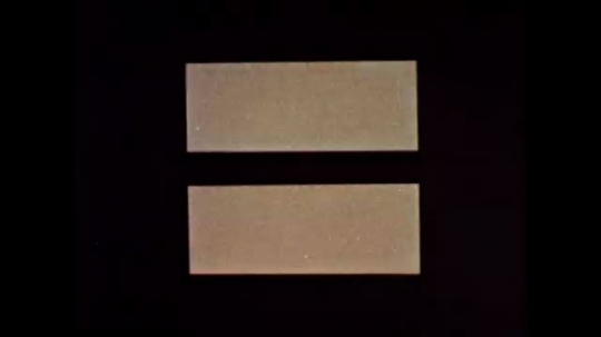 UNITED STATES: 1960s: white rectangles on dark background. Shapes split in two. Direction arrows. 