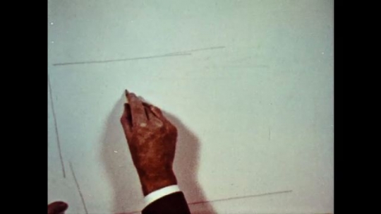 UNITED STATES: 1960s: hand draws landscape on paper. 