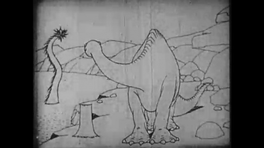 1910s: Animation, dinosaur looks at creature in water, stomps feet, begs for food, eats food. 