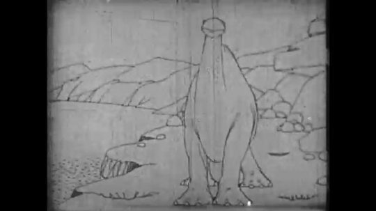 1910s: Animation, dinosaur shakes head, drinks from river. 
