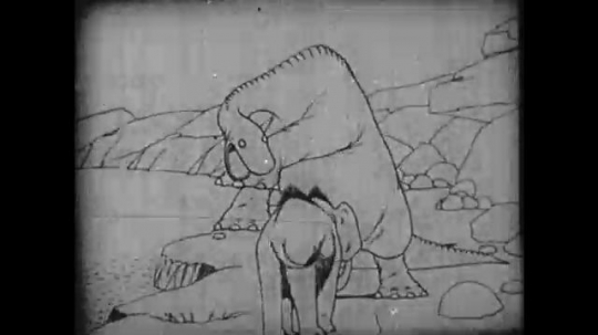 1910s: Animation, dinosaur throws mammoth into river, mammoth sprays dinosaur, dinosaur throws rock at mammoth. 