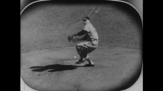 1950s: Baseball player on TV pitches. Batter hits ball and runs. Woman, girl and two boys watch baseball game on television. Players advance from second to third base, and third base to home plate.