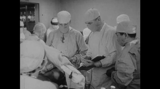 1950s: Doctor takes notes. Doctors operate on patient. Doctor points to diagram of brain.