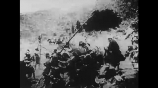 1910s: UNITED STATES: men fight in battle. Lady looks up to sky. Soldiers fire bows. Horse hit by arrow
