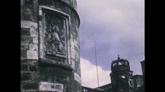 1940s: Carving on exterior of castle. Interior of castle. Views of townhouse. Animated map of Scotland. 
