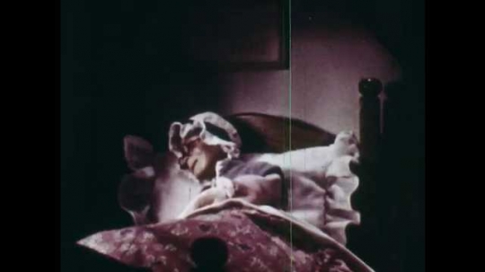 1940s: Animation of grandmother in bed. She wakes up, screams and gets out. Wolf enters house, grandmother runs into a corner afraid, wolf approaches. Grandmother screams, throws table in wolf?? way.