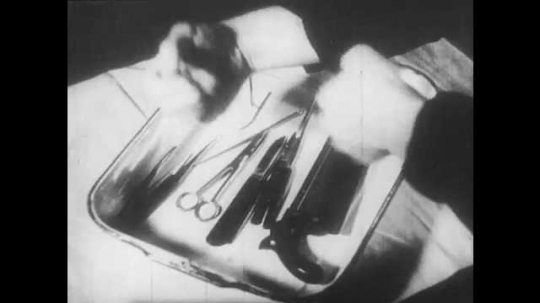 1930s: 1860s reenactment. A man rolls up his sleeves and pours antiseptic over surgical tools in a tray. A 1930s nurse prepares instruments in a similar way. Surgeons use the sterilized instruments.
