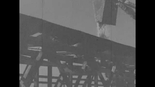 1920s: A hopper drops salt onto a conveyor belt. Salt moves along the belt.